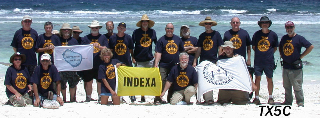 That's me, the big guy with the stupid hat in the middle.  Good thing I had that hat or my nose would have been burned off.  Click here to visit my TX5C clipperton adventure.